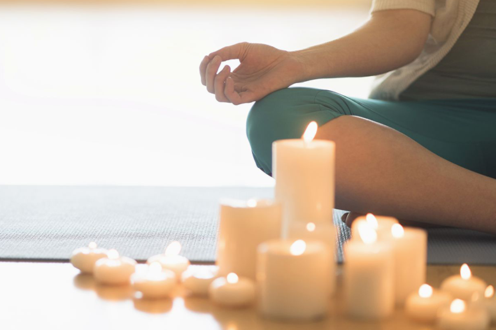 Woman%20Meditating%20Candles 1